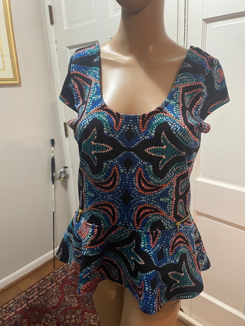 Bebe Patterned Peplum Top in Black with Blue & Coral Accents